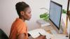 Woman reading a text on a computer